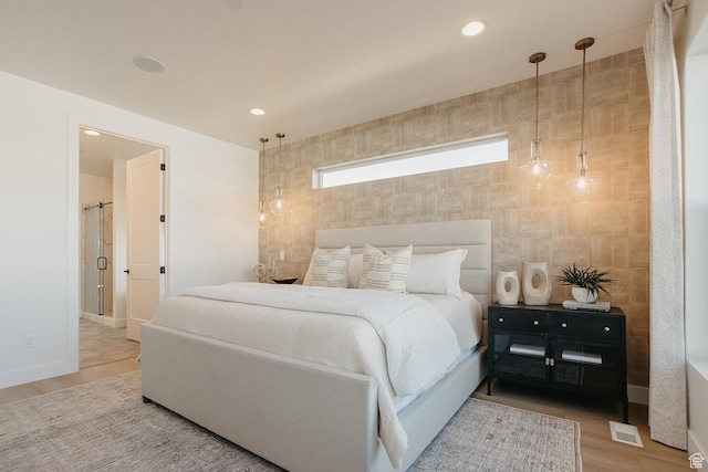 3488 E 1120 S Unit 115, Spanish Fork, UT 84660 - bedroom featuring wood finished floors, recessed lighting, and tile walls