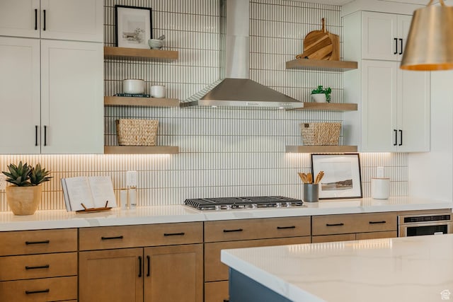 3488 E 1120 S Unit 115, Spanish Fork, UT 84660 - kitchen featuring open shelves, wall chimney range hood, appliances with stainless steel finishes, tasteful backsplash, and white cabinetry