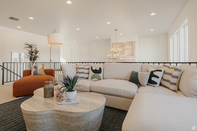 3488 E 1120 S Unit 115, Spanish Fork, UT 84660 - living room featuring a chandelier, recessed lighting, and a decorative wall