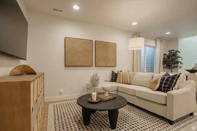 3488 E 1120 S Unit 115, Spanish Fork, UT 84660 - living room with stairway, recessed lighting, and light wood-type flooring