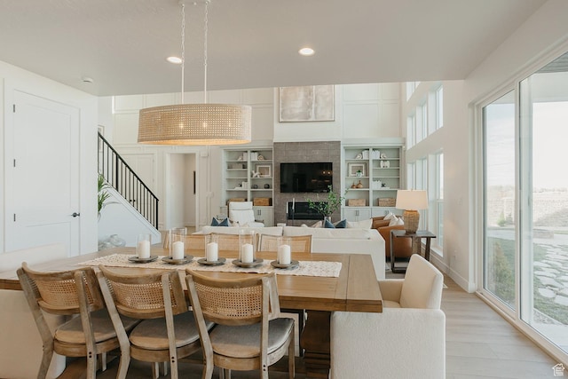 3488 E 1120 S Unit 115, Spanish Fork, UT 84660 - dining room featuring stairs, recessed lighting, light wood-style flooring, and a tile fireplace