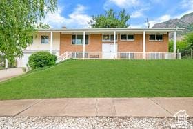 1708 Hislop Dr, Ogden, UT 84404 - view of front of property featuring a front lawn