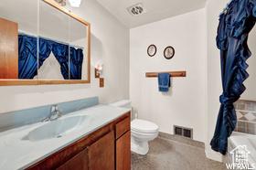 1708 Hislop Dr, Ogden, UT 84404 - full bath featuring vanity and a bath