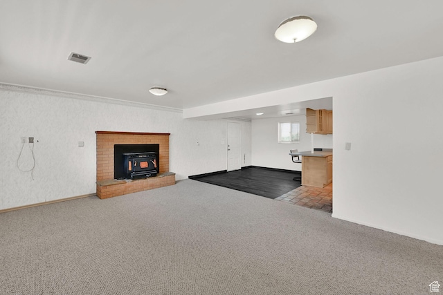 1708 Hislop Dr, Ogden, UT 84404 - unfurnished living room featuring a wood stove and carpet floors