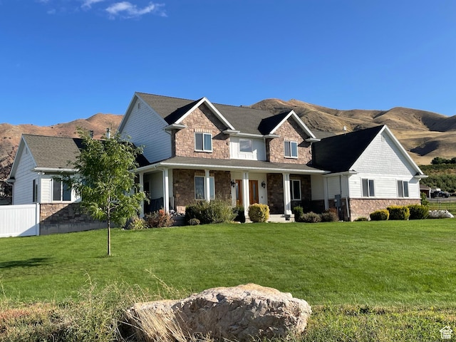 70 W 1790 N, Genola, UT 84655 - view of front of property with stone siding, a mountain view, and covered porch