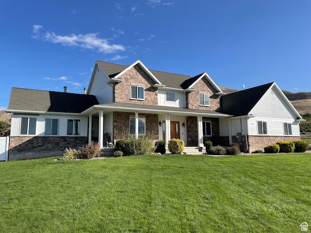 70 W 1790 N, Genola, UT 84655 - view of front of property with stone siding, a front yard, and a porch
