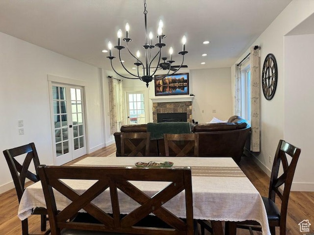 70 W 1790 N, Genola, UT 84655 - dining space featuring wood finished floors, a chandelier, a fireplace, and recessed lighting