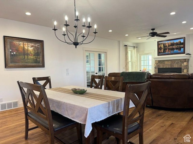 70 W 1790 N, Genola, UT 84655 - dining room featuring wood finished floors, recessed lighting, a chandelier, a ceiling fan, and a stone fireplace