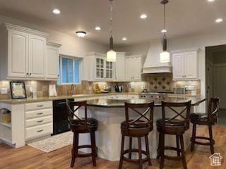 70 W 1790 N, Genola, UT 84655 - kitchen with black dishwasher, custom exhaust hood, recessed lighting, white cabinetry, and a breakfast bar area