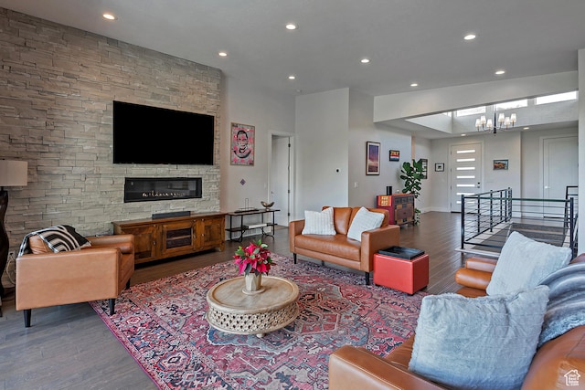 68 E Columbus Ct, Salt Lake City, UT 84103 - living room featuring wood finished floors, recessed lighting, a chandelier, and a stone fireplace