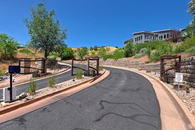 68 E Columbus Ct, Salt Lake City, UT 84103 - view of asphalt street with curbs and a gated entry