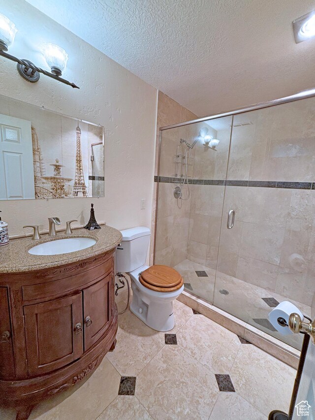 289 W Count Fleet Rd, St George, UT 84790 - full bath with a textured ceiling, a stall shower, and vanity