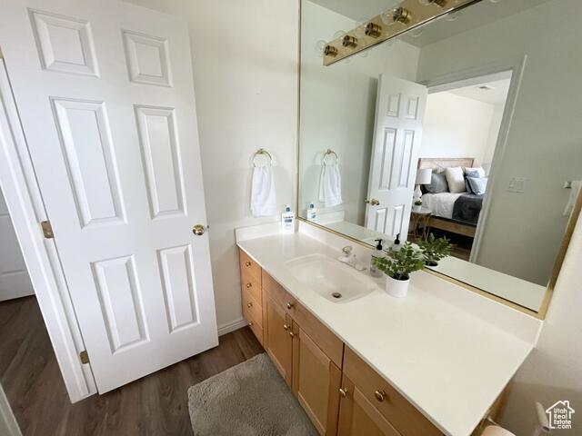 1845 Canyon Dr W Unit 1206, St George, UT 84770 - bathroom featuring vanity, wood finished floors, and connected bathroom