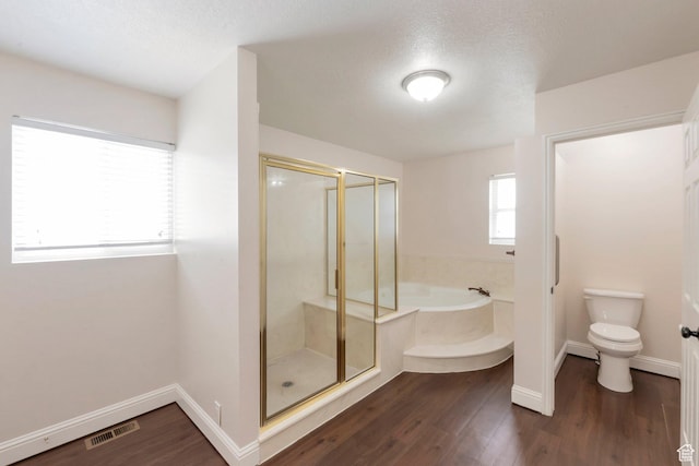 335 W 1410 S, Orem, UT 84058 - bathroom with a garden tub, a stall shower, wood finished floors, and a textured ceiling