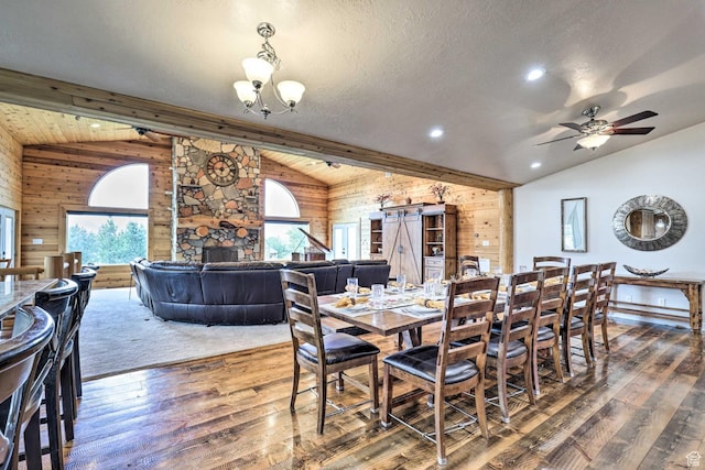 3572 Wild Mare Way, Heber City, UT 84032 - dining area with vaulted ceiling, wooden walls, healthy amount of natural light, hardwood / wood-style floors, and a chandelier