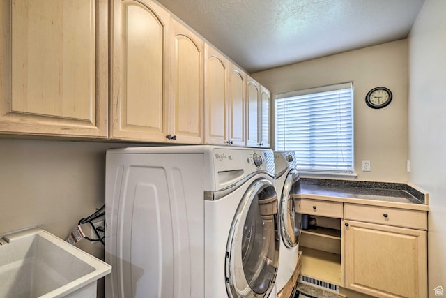 3572 Wild Mare Way, Heber City, UT 84032 - laundry room featuring washing machine and clothes dryer, cabinet space, and a textured ceiling