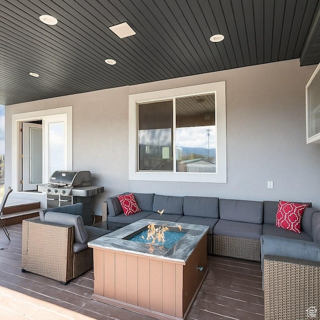 3572 Wild Mare Way, Heber City, UT 84032 - deck with an outdoor living space with a fire pit and area for grilling