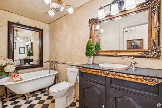 1526 W Red Hawk Trl, Park City, UT 84098 - full bathroom featuring a soaking tub, vanity, tile patterned floors, and a wainscoted wall