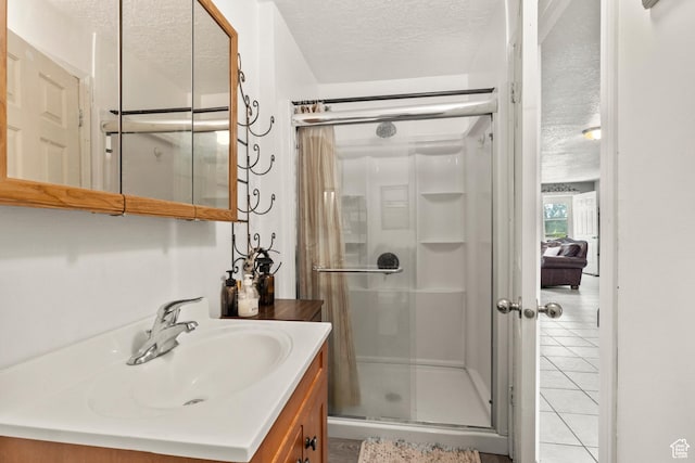 165 N 800 E, Hyrum, UT 84319 - bathroom with a textured ceiling, a stall shower, vanity, and tile patterned flooring