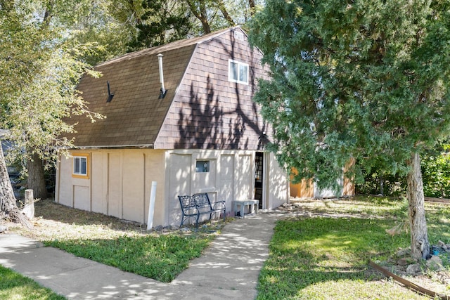 165 N 800 E, Hyrum, UT 84319 - view of front of home with a gambrel roof, a barn, an outdoor structure, roof with shingles, and a front yard