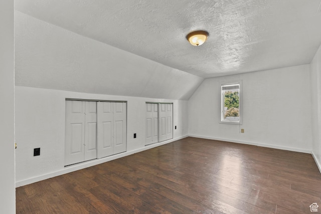 165 N 800 E, Hyrum, UT 84319 - bonus room featuring a textured ceiling, vaulted ceiling, and wood finished floors