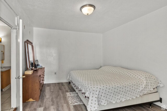 165 N 800 E, Hyrum, UT 84319 - bedroom featuring wood finished floors and baseboards