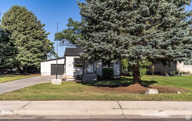170 S 1300 E, Springville, UT 84663 - view of property hidden behind natural elements with concrete driveway, a garage, and a front lawn