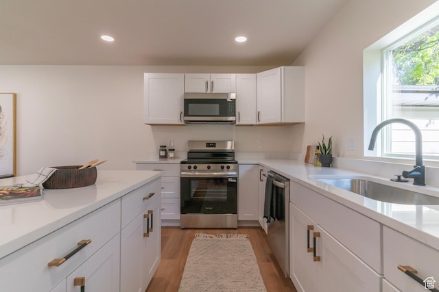 170 S 1300 E, Springville, UT 84663 - kitchen featuring stainless steel appliances, light wood-style flooring, white cabinetry, light countertops, and recessed lighting