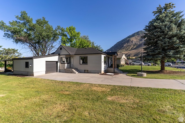 170 S 1300 E, Springville, UT 84663 - view of front facade featuring a garage, concrete driveway, a mountain view, and a front lawn