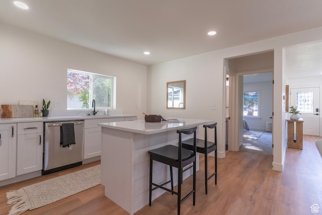 170 S 1300 E, Springville, UT 84663 - kitchen featuring stainless steel dishwasher, a breakfast bar, a kitchen island, plenty of natural light, and recessed lighting