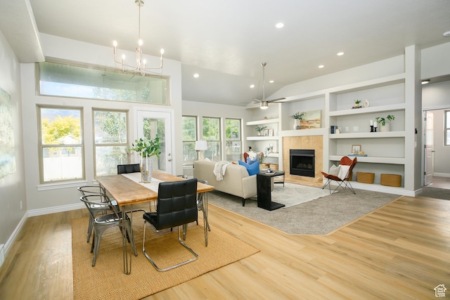 1103 Vista Dr, Santaquin, UT 84655 - dining space featuring light wood-style floors, a fireplace, vaulted ceiling, built in features, and recessed lighting