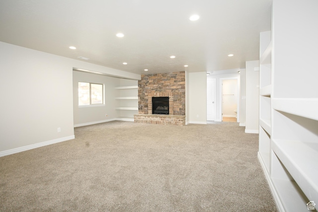 1103 Vista Dr, Santaquin, UT 84655 - unfurnished living room featuring light carpet, recessed lighting, and a stone fireplace