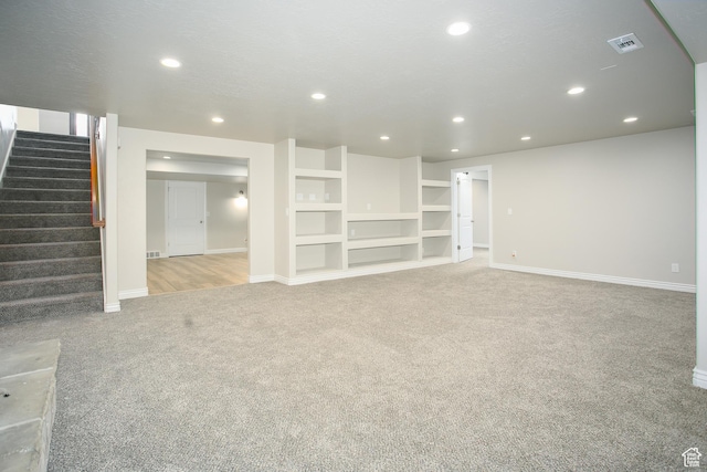 1103 Vista Dr, Santaquin, UT 84655 - unfurnished living room with carpet, recessed lighting, and stairway
