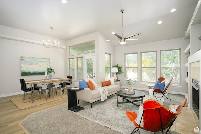1103 Vista Dr, Santaquin, UT 84655 - living room with recessed lighting, light wood-style floors, a fireplace, a chandelier, and ceiling fan