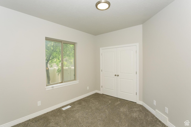 1103 Vista Dr, Santaquin, UT 84655 - unfurnished bedroom with dark carpet and a closet