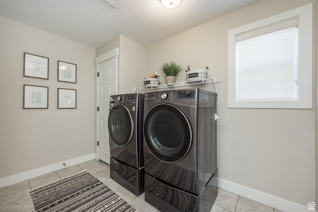 1476 W Stone Gate Dr, Saratoga Springs, UT 84045 - laundry area with washer and clothes dryer and light tile patterned flooring