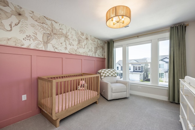 1476 W Stone Gate Dr, Saratoga Springs, UT 84045 - carpeted bedroom featuring multiple windows, a nursery area, a decorative wall, a wainscoted wall, and wallpapered walls