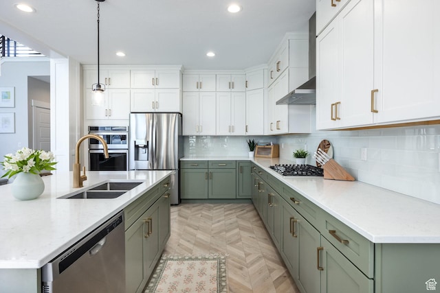 1476 W Stone Gate Dr, Saratoga Springs, UT 84045 - kitchen with appliances with stainless steel finishes, green cabinets, white cabinetry, recessed lighting, and backsplash