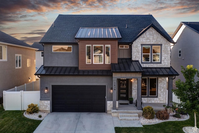 1476 W Stone Gate Dr, Saratoga Springs, UT 84045 - view of front of property featuring a standing seam roof, stone siding, a metal roof, concrete driveway, and an attached garage