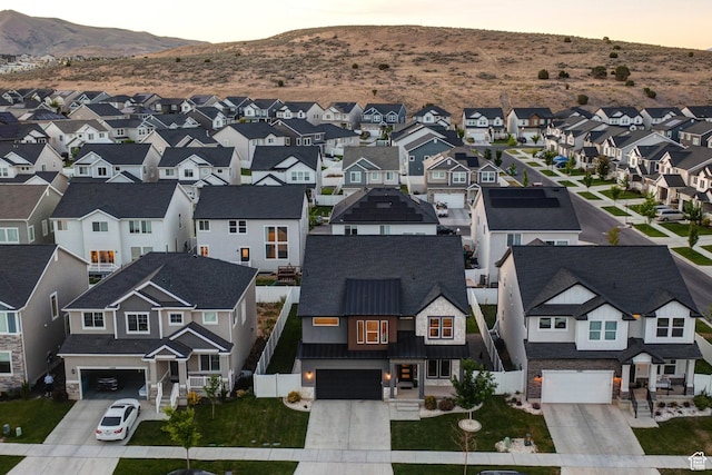 1476 W Stone Gate Dr, Saratoga Springs, UT 84045 - aerial view at dusk of a residential view and a mountain view