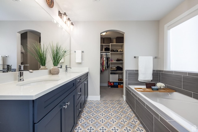 1476 W Stone Gate Dr, Saratoga Springs, UT 84045 - bathroom with double vanity, a garden tub, and a walk in closet