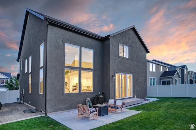 1476 W Stone Gate Dr, Saratoga Springs, UT 84045 - rear view of property featuring a patio, stucco siding, and a fire pit