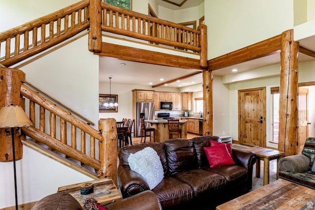 8437 Pointe Dr, Park City, UT 84098 - living area featuring a chandelier, stairs, recessed lighting, and a high ceiling
