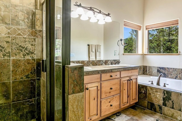 8437 Pointe Dr, Park City, UT 84098 - bathroom with double vanity, a garden tub, stone finish floors, and a shower with door
