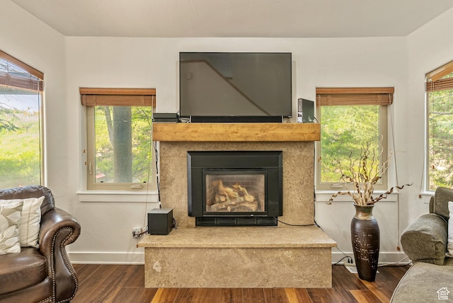 5150 Cove Canyon Dr Unit A, Park City, UT 84098 - living area with dark wood-style floors and a glass covered fireplace