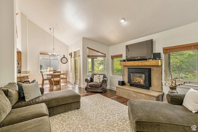 5150 Cove Canyon Dr Unit A, Park City, UT 84098 - living room with wood finished floors, a chandelier, a premium fireplace, and high vaulted ceiling