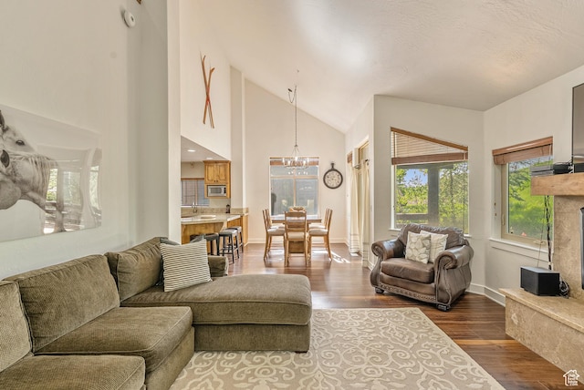 5150 Cove Canyon Dr Unit A, Park City, UT 84098 - living room with a chandelier, dark wood-type flooring, and high vaulted ceiling