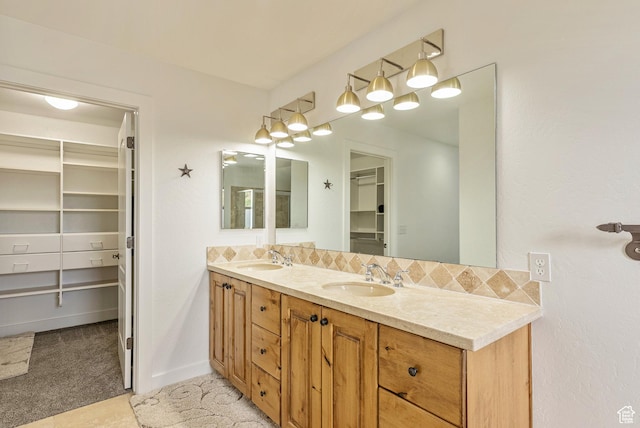 5150 Cove Canyon Dr Unit A, Park City, UT 84098 - bathroom with double vanity, a walk in closet, and backsplash