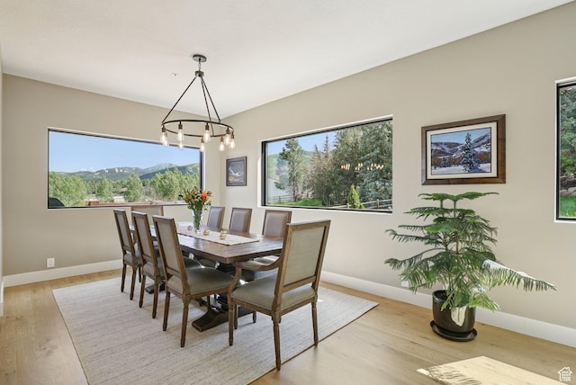 2570 Aspen Springs Dr, Park City, UT 84060 - dining area with a chandelier and light wood-style flooring