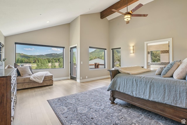 2570 Aspen Springs Dr, Park City, UT 84060 - bedroom featuring light wood-style flooring, multiple windows, high vaulted ceiling, beam ceiling, and a ceiling fan